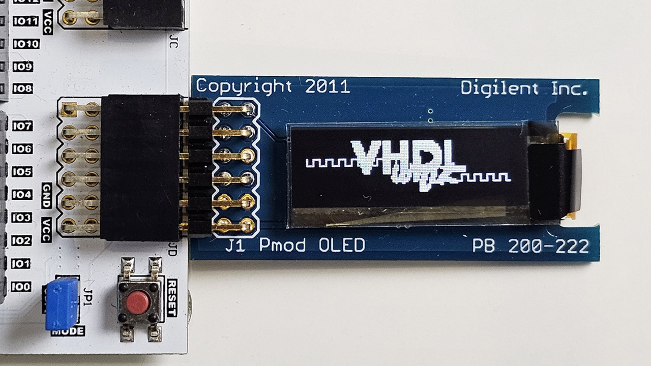 Pmod OLED display module connected to an FPGA development board